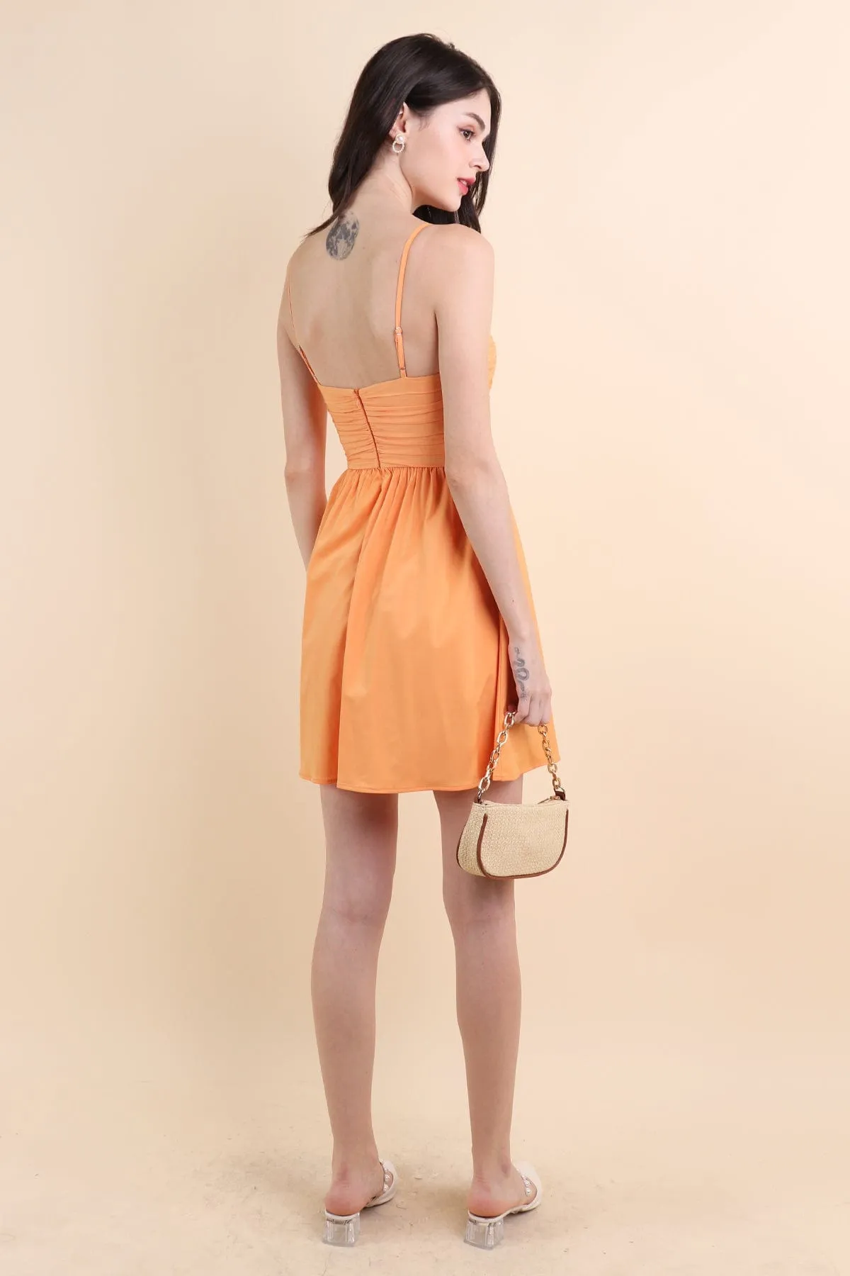 LOLA SLEEVELESS RUCHED ROMPER DRESS IN ORANGE